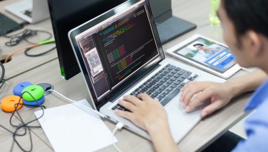 Asian,Developer,Using,Laptop,Computer,Sitting,Working,Real,Office Asian,Developer,Using,Laptop,Computer,Sitting,Working,Real,Office